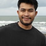 front view smiley man seaside